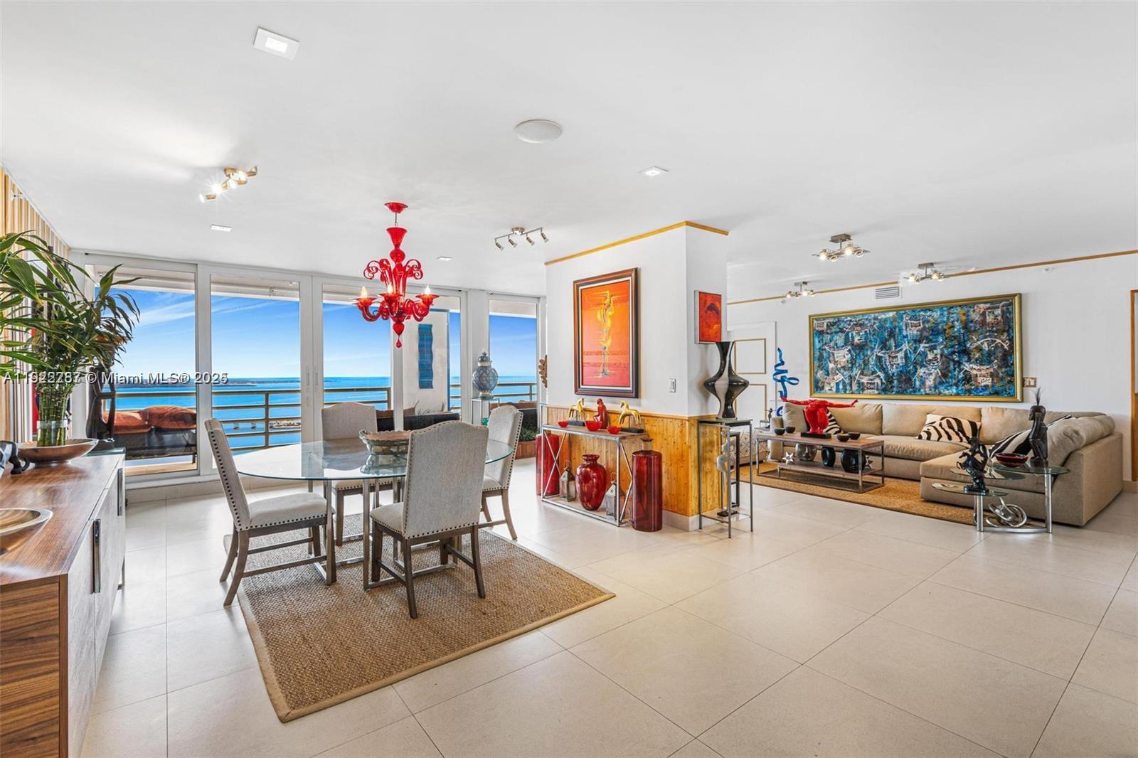 1541 Brickell Avenue, Unit A3902 Miami, FL 33129 - Photo 7 of 24 a living room with furniture and a chandelier