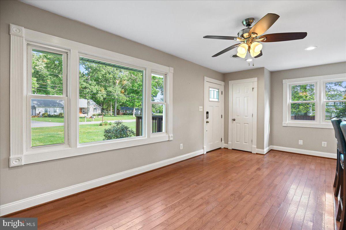 743 Masons Beach Road Deale, MD 20751 - Photo 7 of 39 Living-dining space is combined with kitchen.