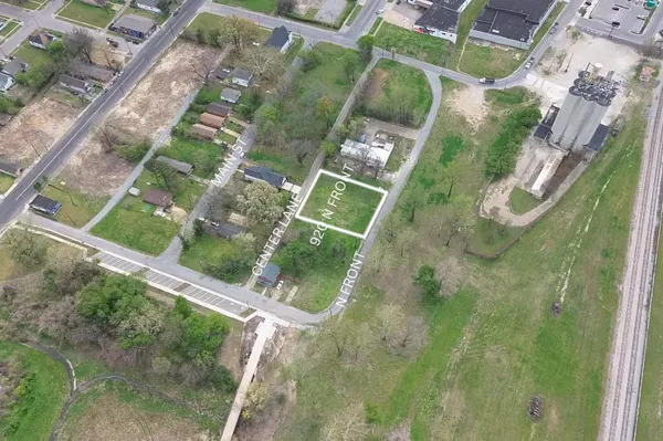 a view of a yard from a balcony