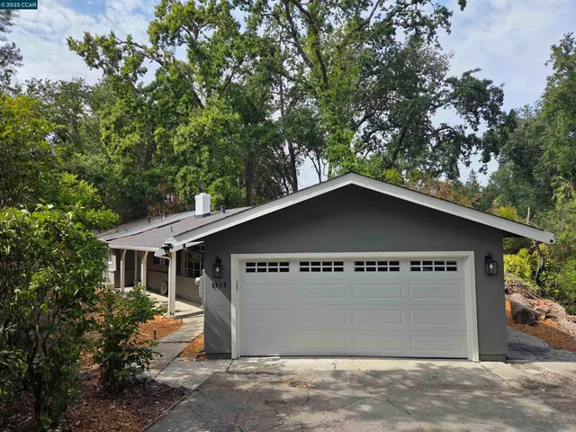 a view of a house with a tree