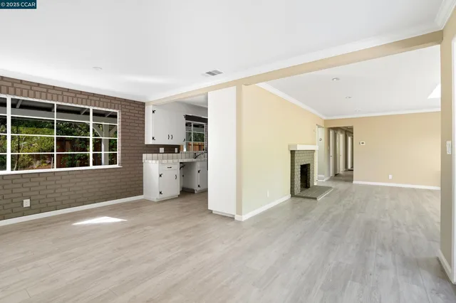 a kitchen with a sink cabinets and window