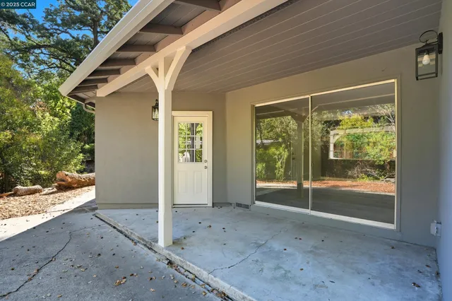a house with trees in the background
