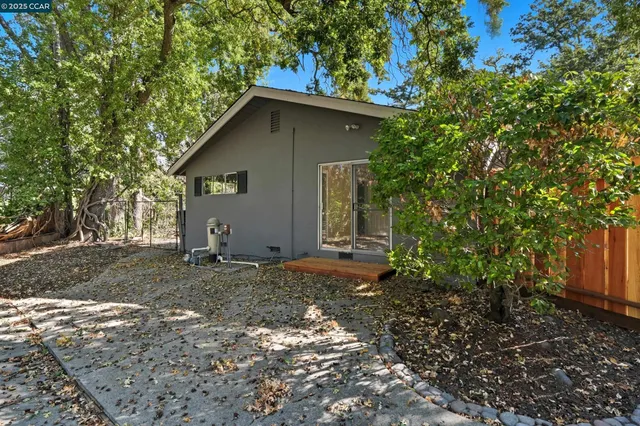 a view of a backyard with chairs