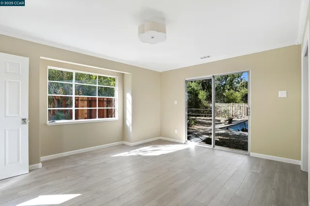 a kitchen with a stove a sink and a microwave