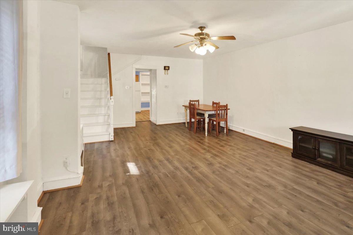 29 Arlington Street Reading, PA 19611 - Photo 7 of 32 wooden floor in an empty room with a window