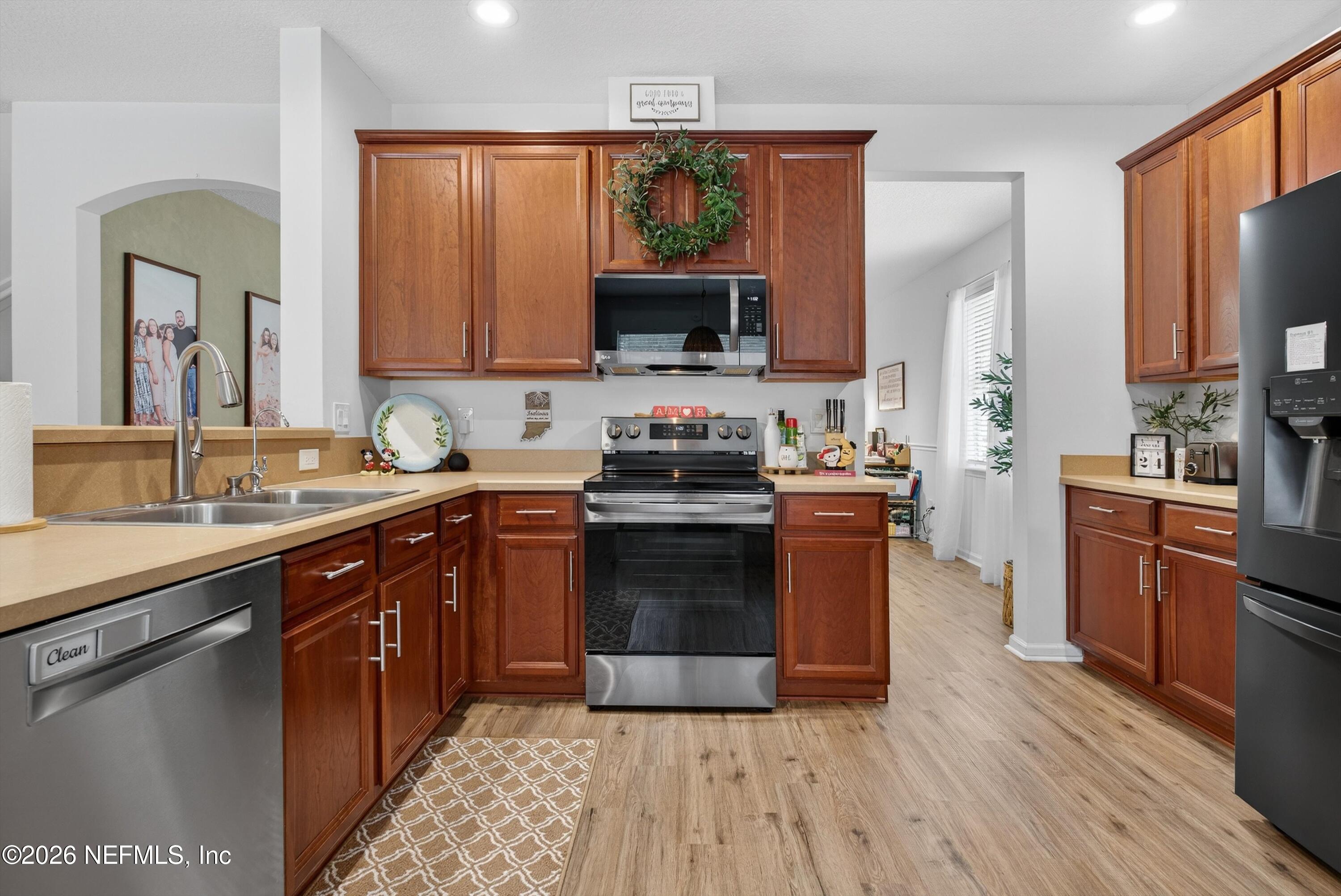 1214 South Kyle Way St. Johns, FL 32259 - Photo 18 of 78 a kitchen with a sink stove and microwave
