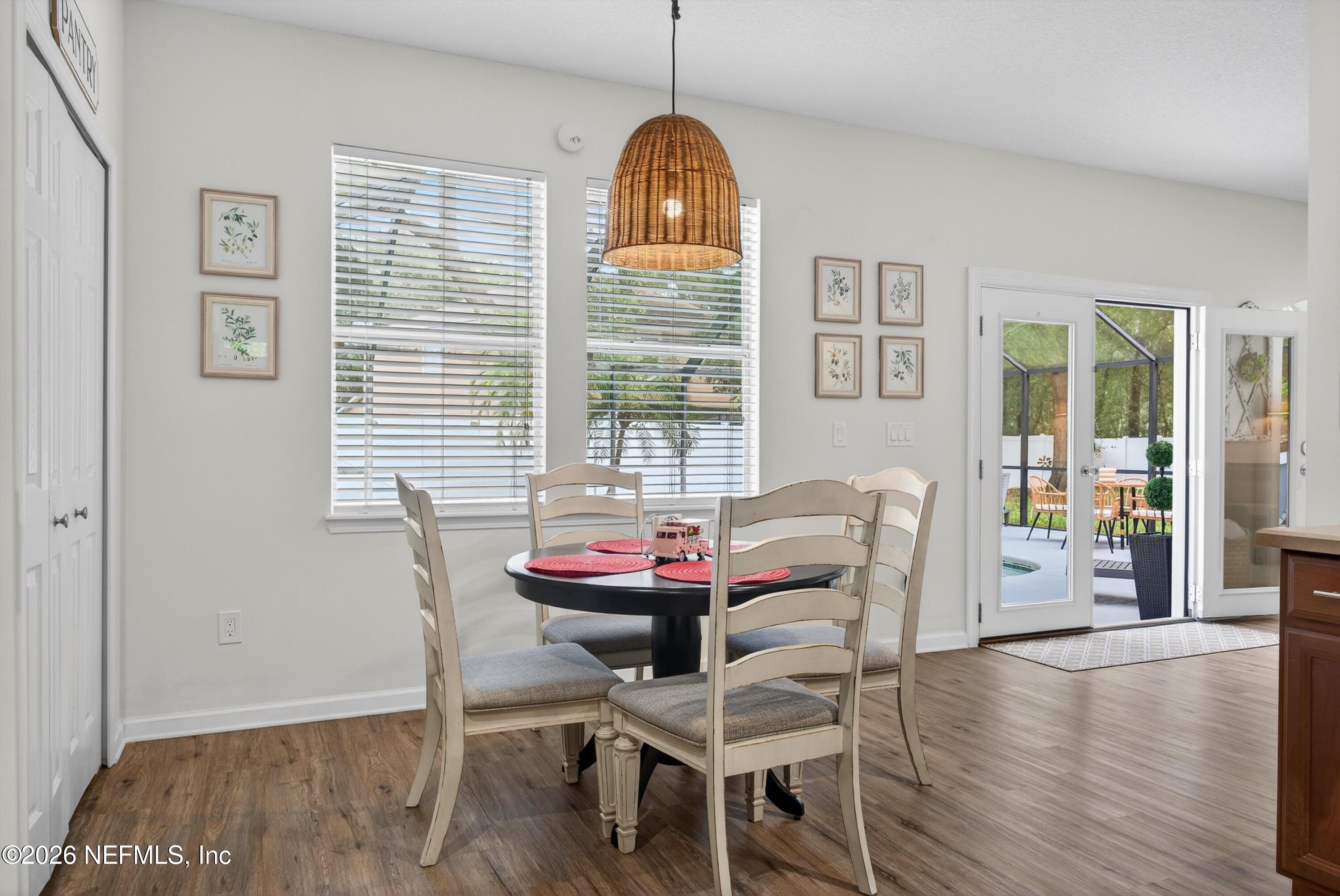 1214 South Kyle Way St. Johns, FL 32259 - Photo 23 of 78 a view of a dining room with furniture window and wooden floor