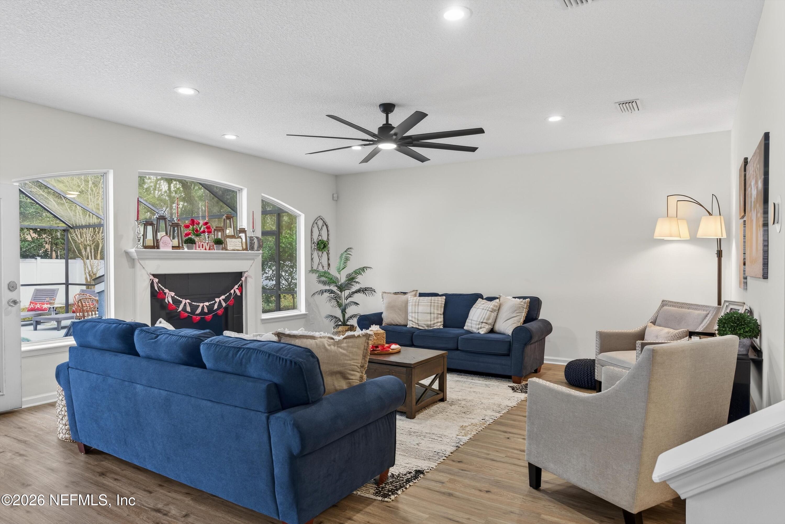 1214 South Kyle Way St. Johns, FL 32259 - Photo 28 of 78 a living room with furniture and a large window