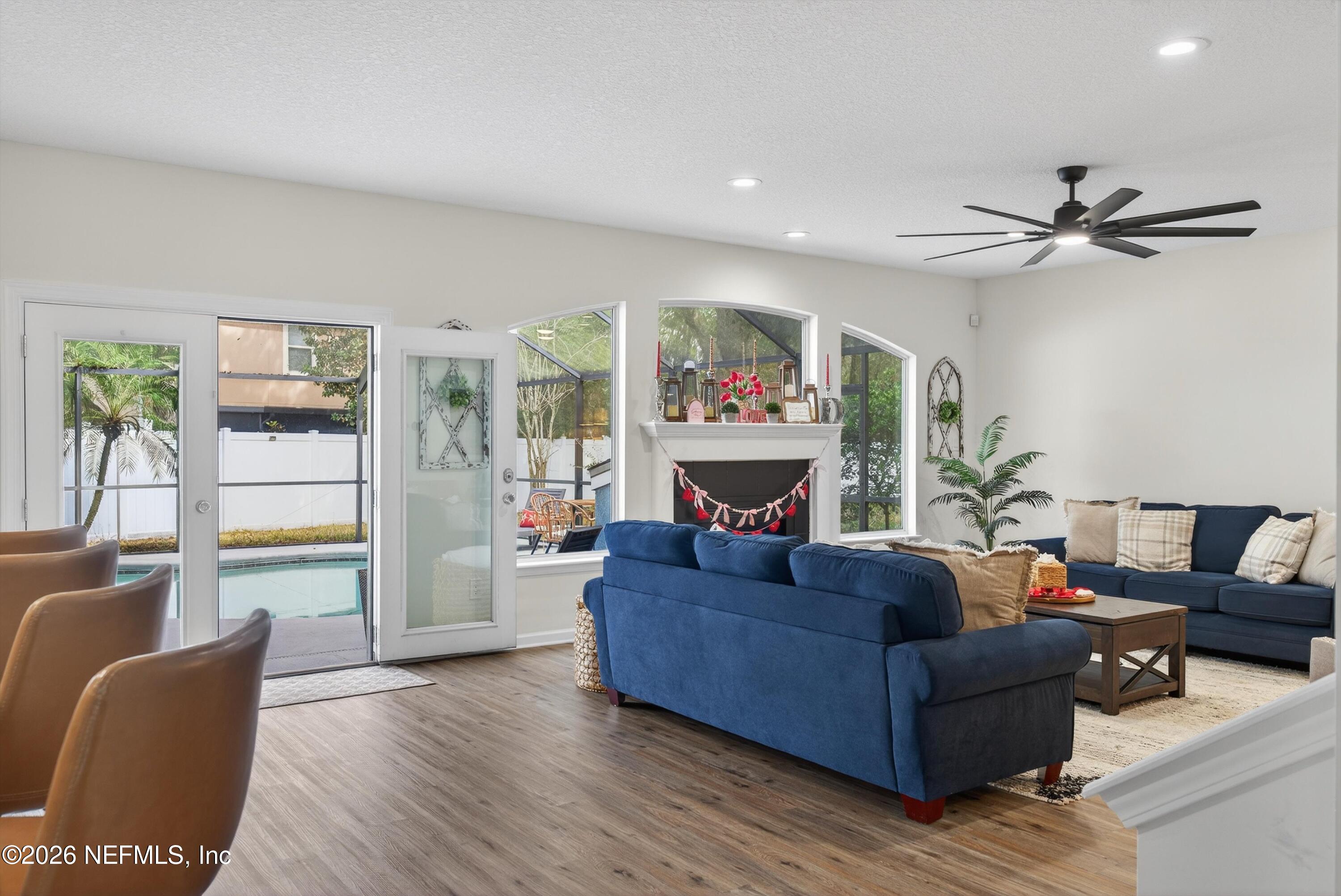 1214 South Kyle Way St. Johns, FL 32259 - Photo 29 of 78 a living room with furniture and a fireplace