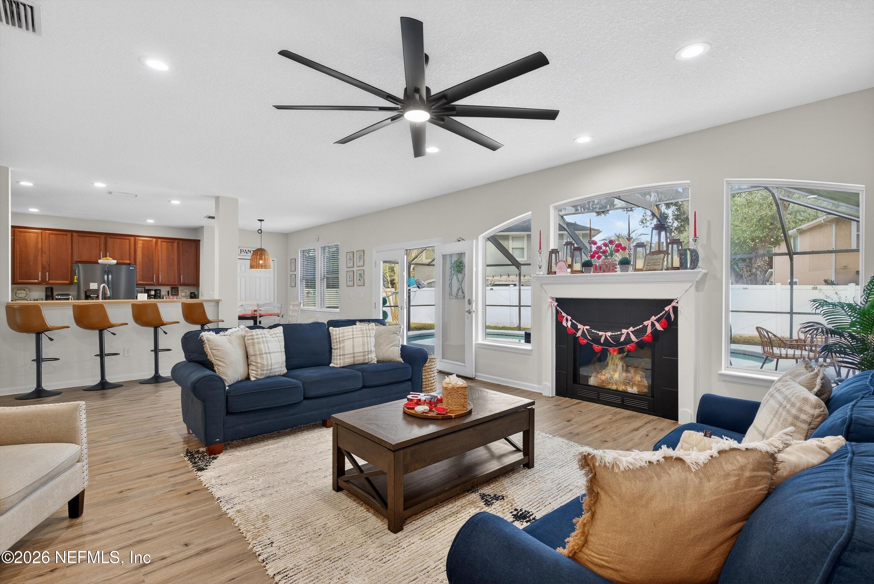 1214 South Kyle Way St. Johns, FL 32259 - Photo 31 of 78 a living room with furniture and a fireplace