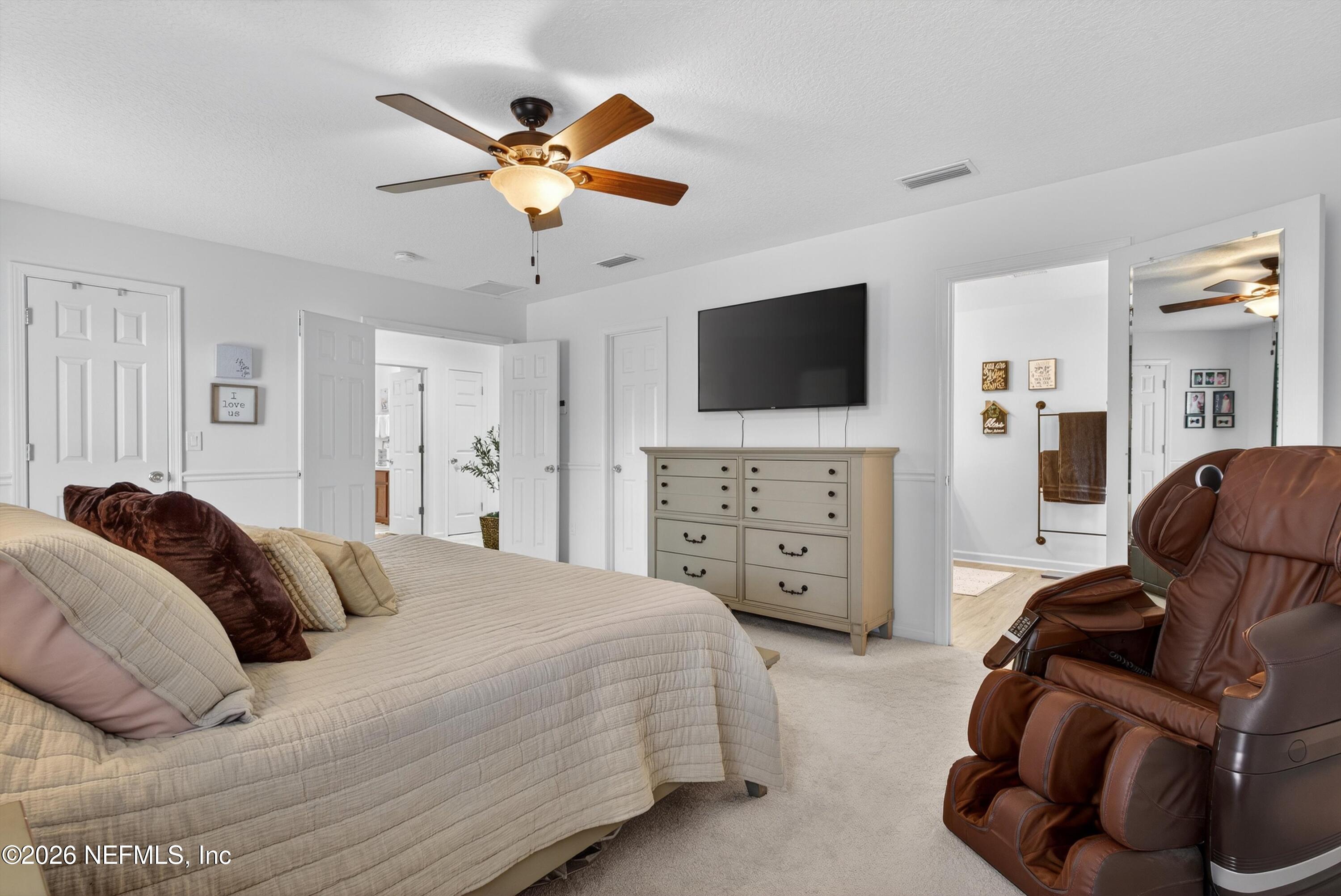 1214 South Kyle Way St. Johns, FL 32259 - Photo 41 of 78 a bedroom with a bed and a flat screen tv