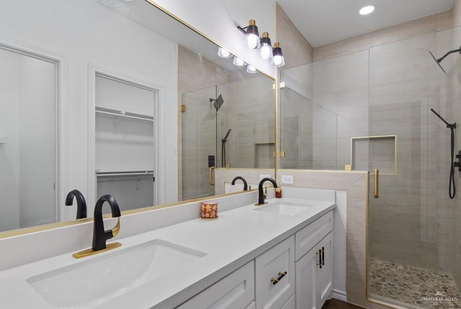 18002 Spruce Street Harlingen, TX 78552 - Photo 15 of 29 a bathroom with a sink vanity and a mirror