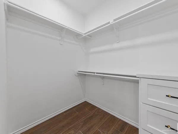 a view of an empty walk in closet