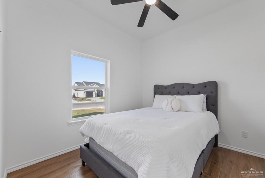 18002 Spruce Street Harlingen, TX 78552 - Photo 19 of 29 a bedroom with a bed and painting on the wall