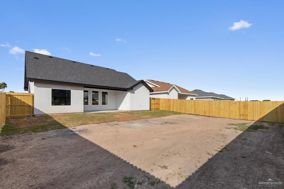 18002 Spruce Street Harlingen, TX 78552 - Photo 26 of 29 a house with trees in front of it