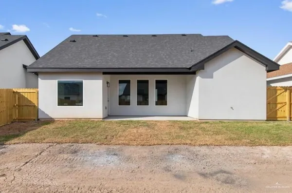 a house with trees in the background