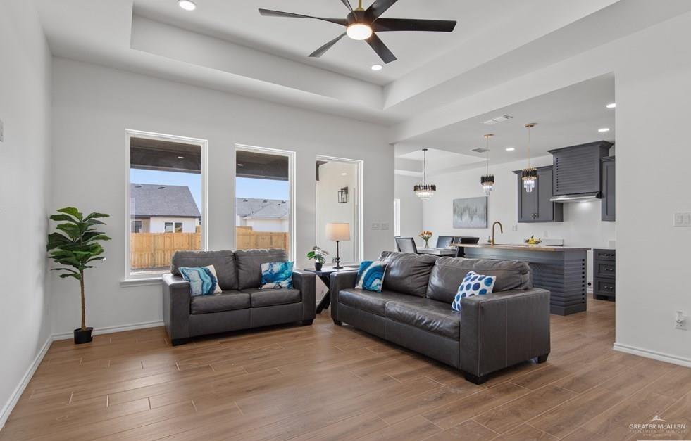 18002 Spruce Street Harlingen, TX 78552 - Photo 6 of 29 a living room with furniture and a large window