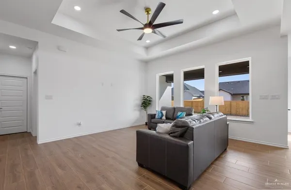 a living room with furniture and a large window