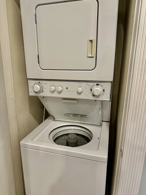 49 Grove Street, Unit 4 Newton, MA 02466 - Photo 11 of 19 a utility room with dryer and washer