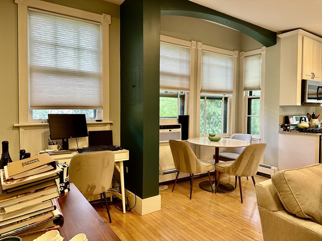 49 Grove Street, Unit 4 Newton, MA 02466 - Photo 15 of 19 a view of a workspace with furniture and a window