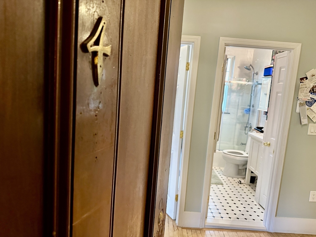 49 Grove Street, Unit 4 Newton, MA 02466 - Photo 8 of 19 a bathroom with a shower and a toilet