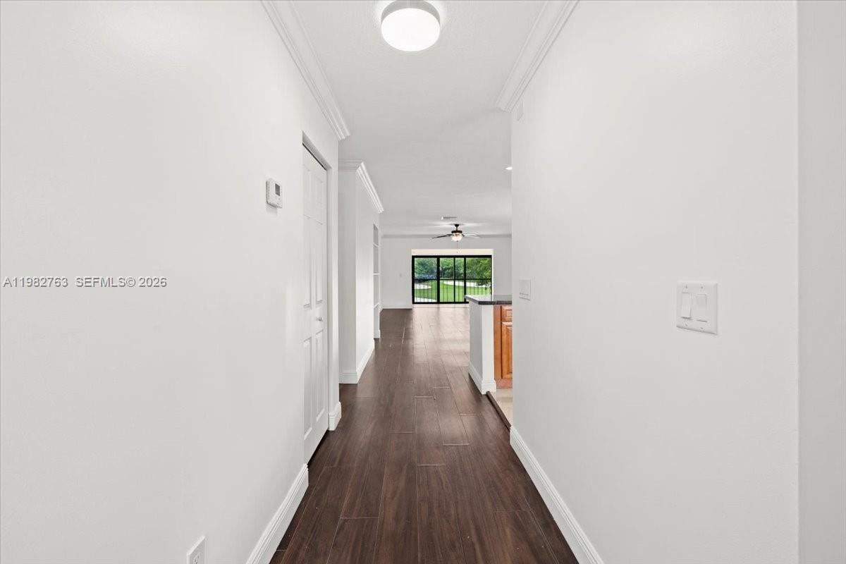 7944 Eastlake Drive, Unit D Boca Raton, FL 33433 - Photo 13 of 29 a view of a hallway with wooden floor
