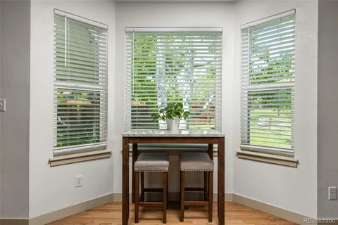 a kitchen with a window and cabinets