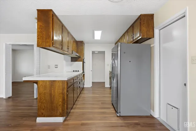 a view of hallway with wooden floor