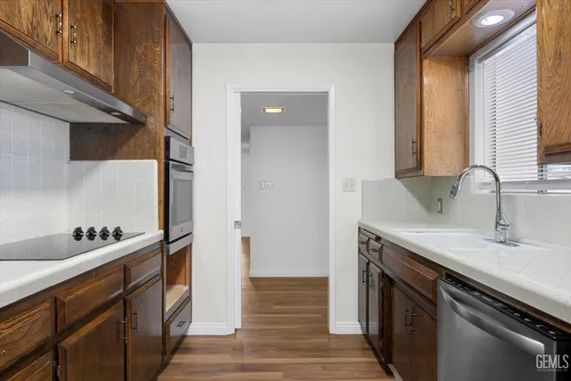 a kitchen with a sink and cabinets
