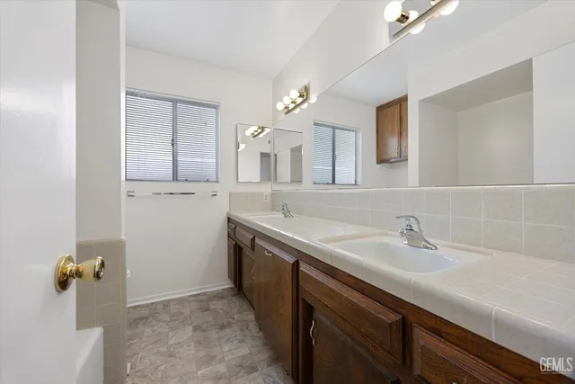a bathroom with a sink and mirror