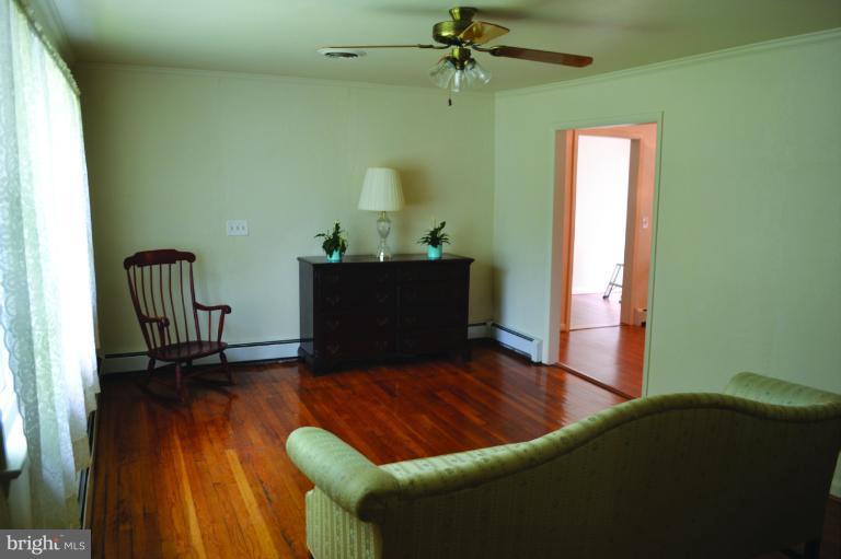 3355 Uniontown Road Westminster, MD 21158 - Photo 17 of 21 a living room with furniture and a wooden floor