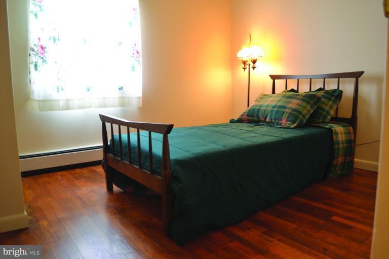 3355 Uniontown Road Westminster, MD 21158 - Photo 19 of 21 a view of a bedroom with wooden floor