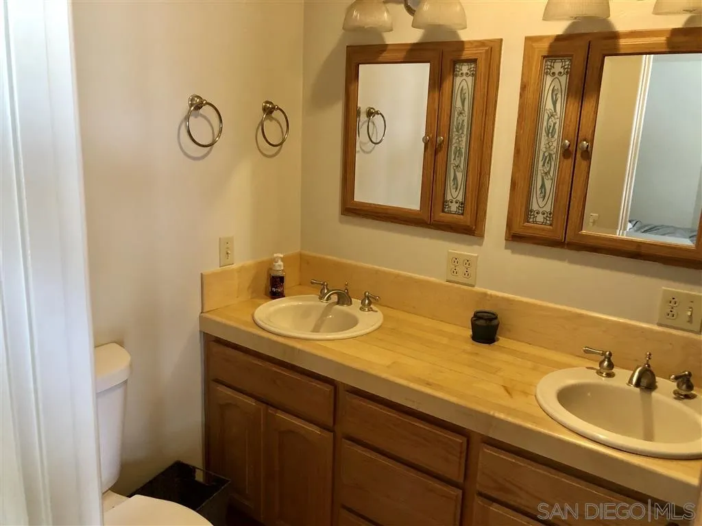 1645 Wilson Road Ramona, CA 92065 - Photo 4 of 13 a bathroom with a sink and a mirror