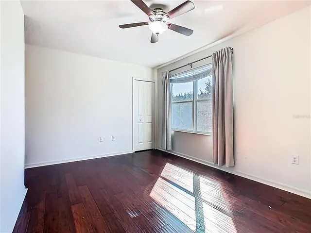 a bathroom with a granite countertop toilet a sink and a bathtub