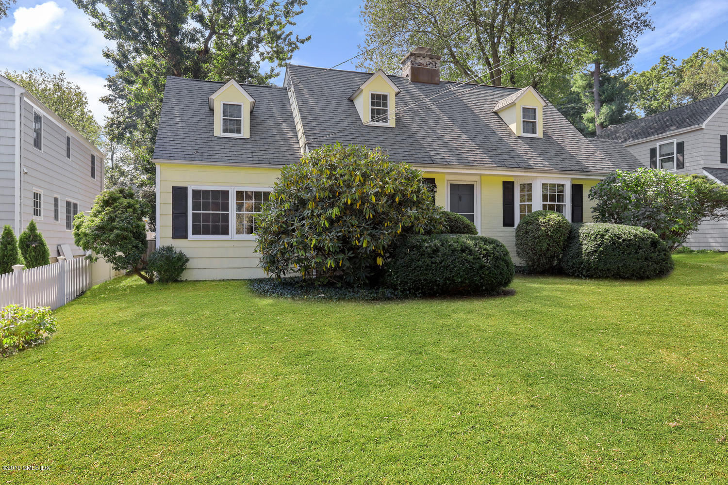 56 Summit Road Riverside, CT 06878 - Photo 1 of 24 front view of a house with a garden