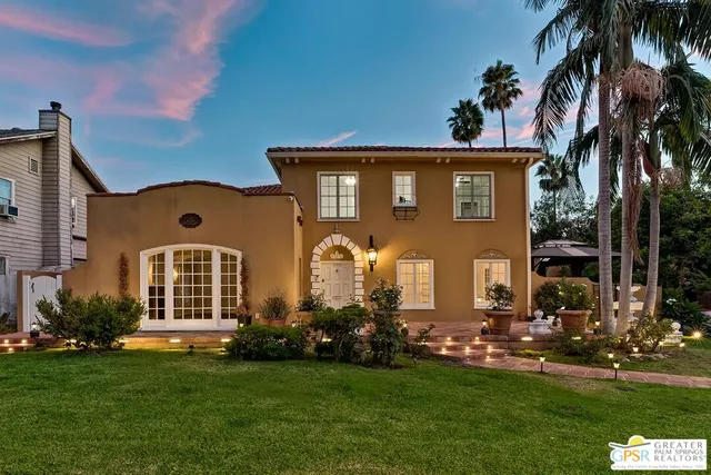 front view of a house with a garden