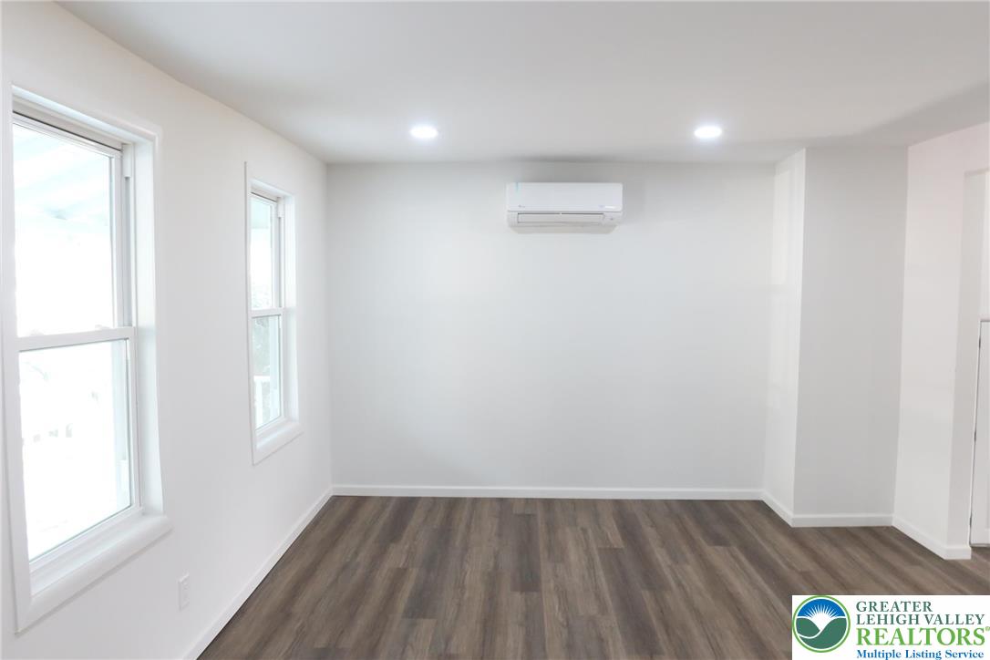 752 2nd Street Catasauqua, PA 18032 - Photo 4 of 23 an empty room with wooden floor and windows