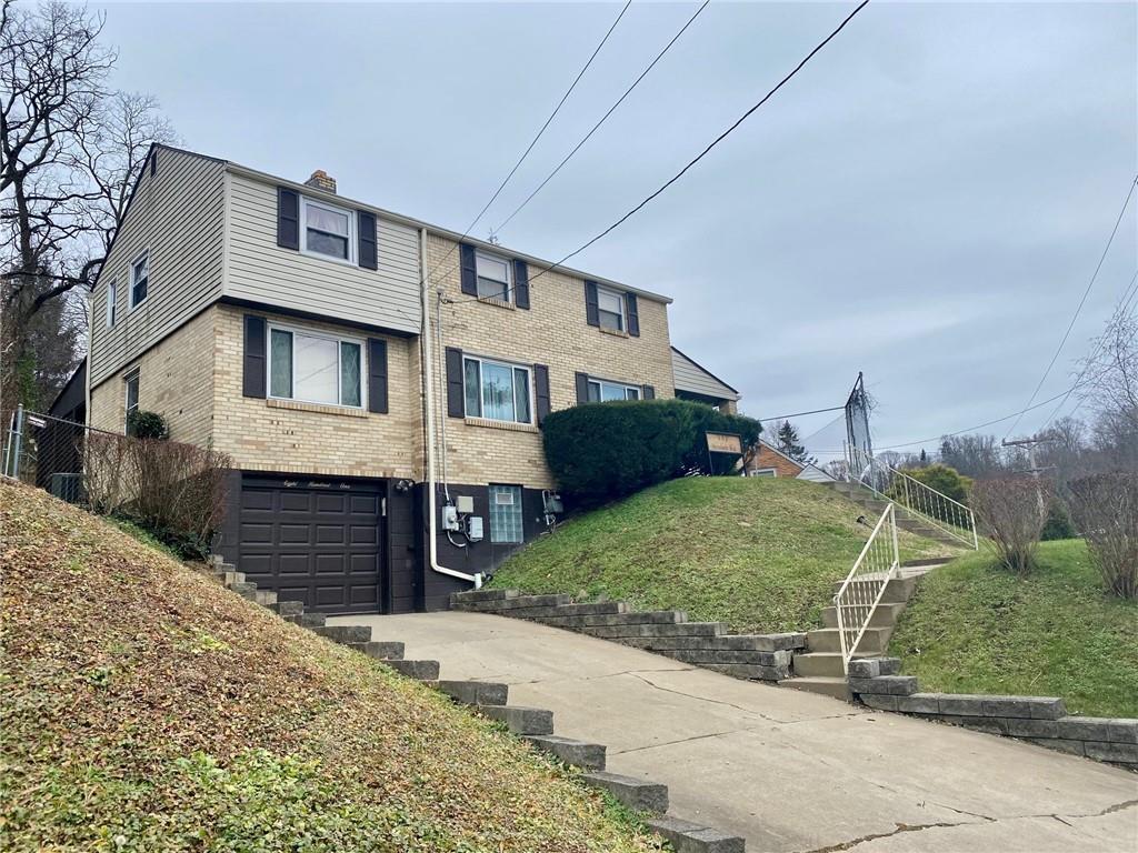 801 Beulah Road Pittsburgh, PA 15235 - Photo 1 of 23 a front view of a house with a yard