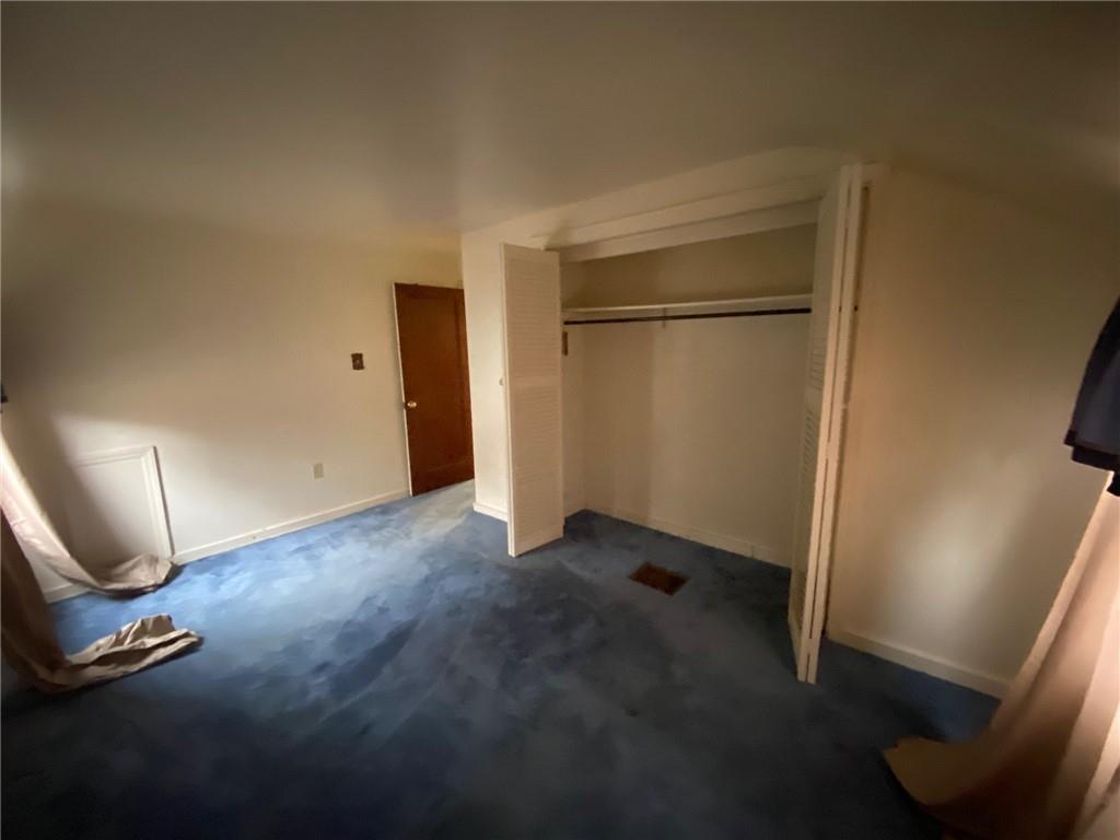 801 Beulah Road Pittsburgh, PA 15235 - Photo 16 of 23 an empty room with wooden floor and mirror