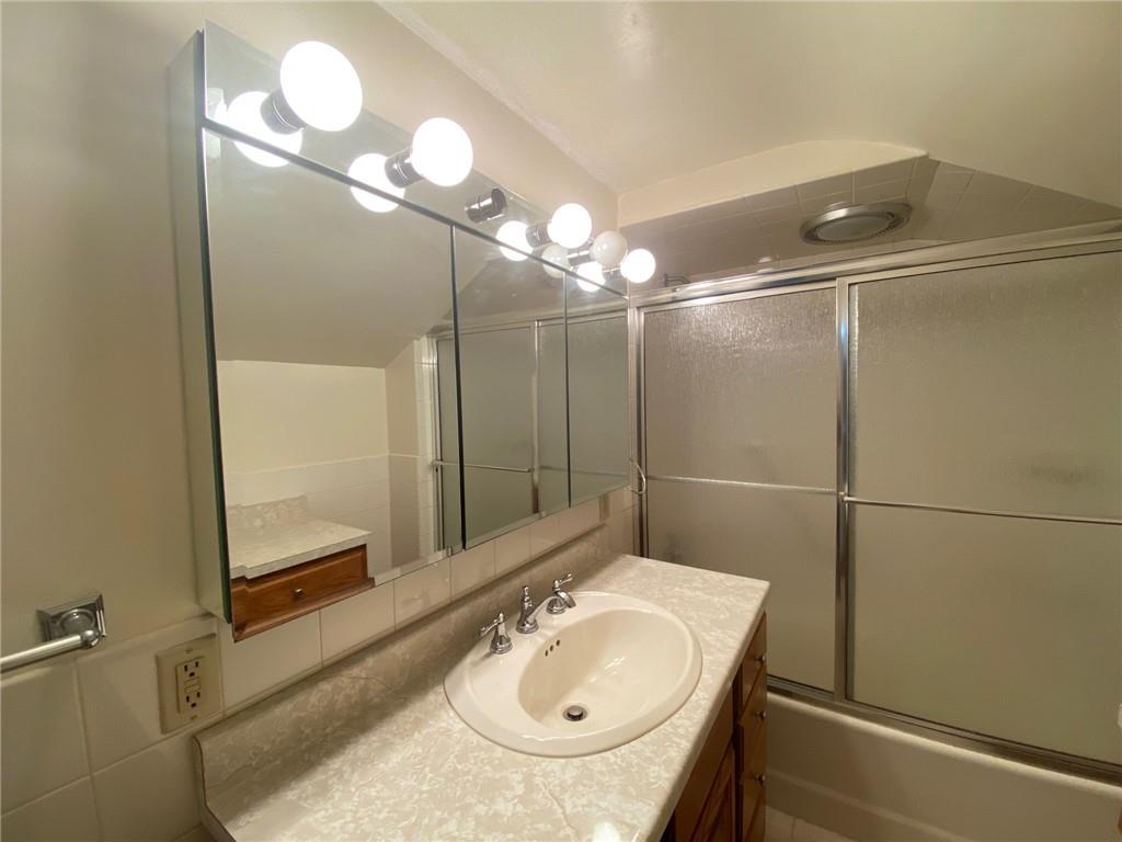 801 Beulah Road Pittsburgh, PA 15235 - Photo 18 of 23 a bathroom with a sink and a mirror