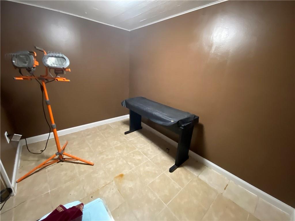 801 Beulah Road Pittsburgh, PA 15235 - Photo 22 of 23 a room with a wooden floor and a ceiling fan