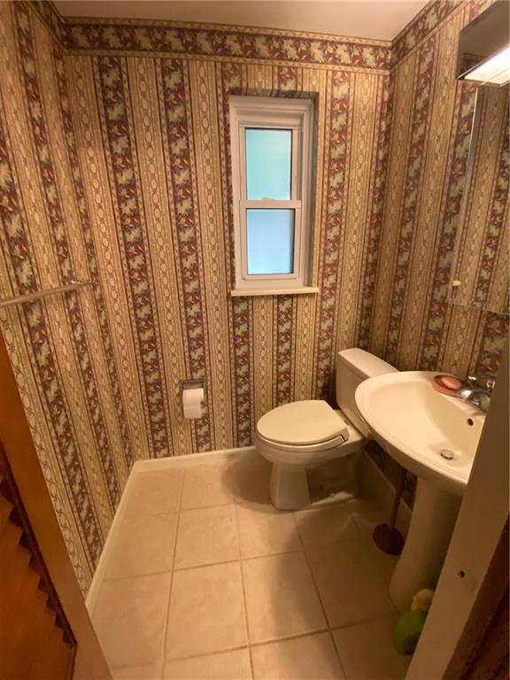 801 Beulah Road Pittsburgh, PA 15235 - Photo 6 of 23 a bathroom with a toilet a sink and shower curtain