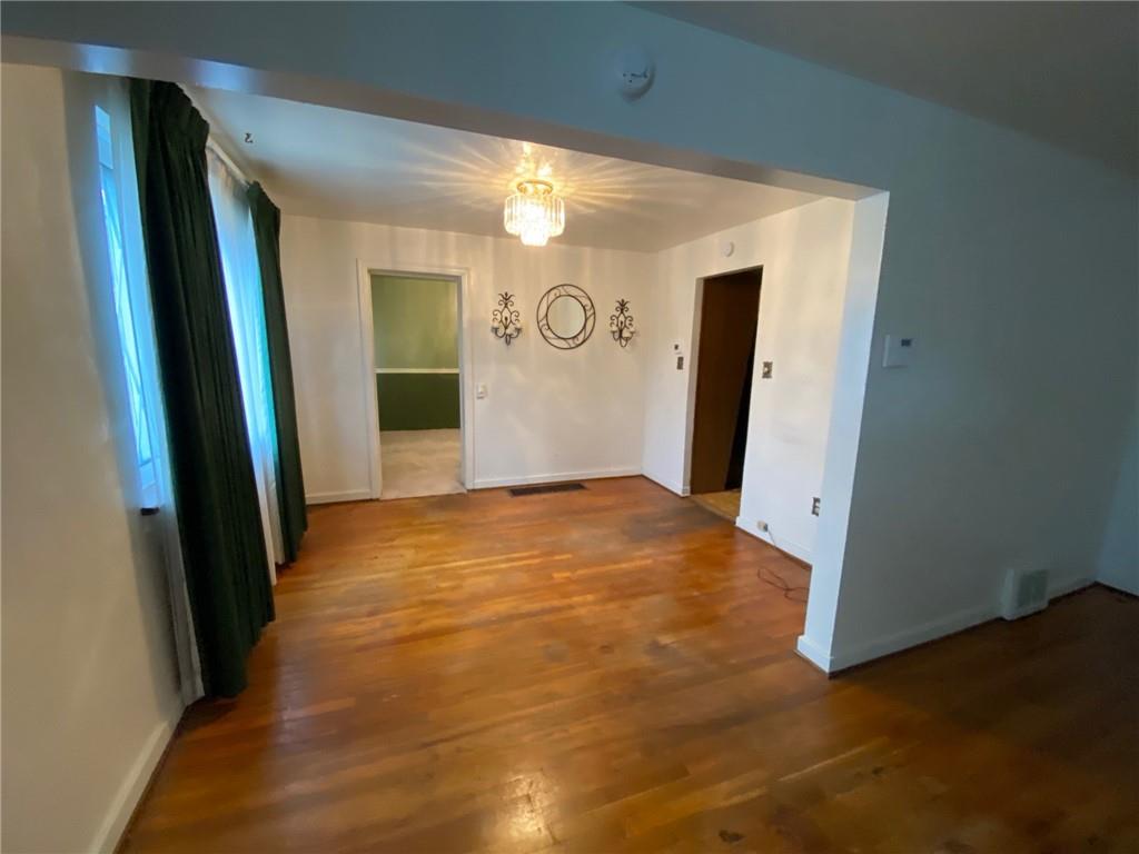 801 Beulah Road Pittsburgh, PA 15235 - Photo 9 of 23 a view of empty room with wooden floor