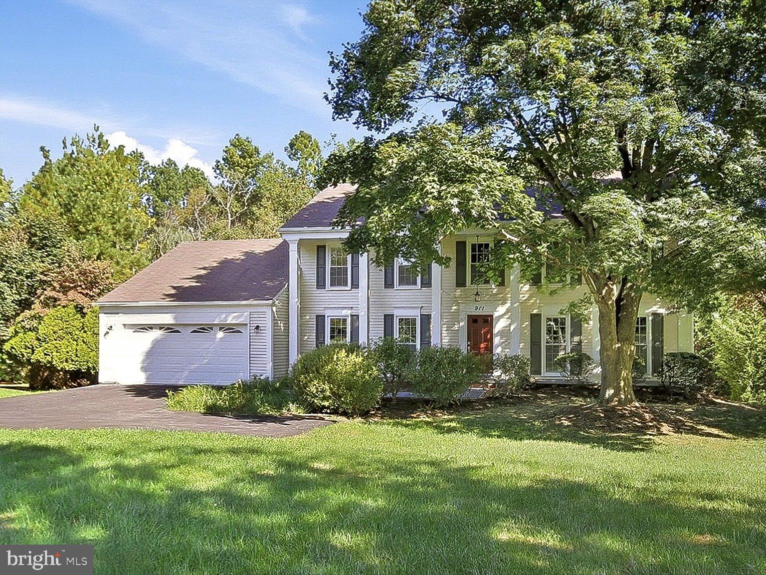 911 Riva Ridge Drive Great Falls, VA 22066 - Photo 3 of 55 Charming home with lush greenery.