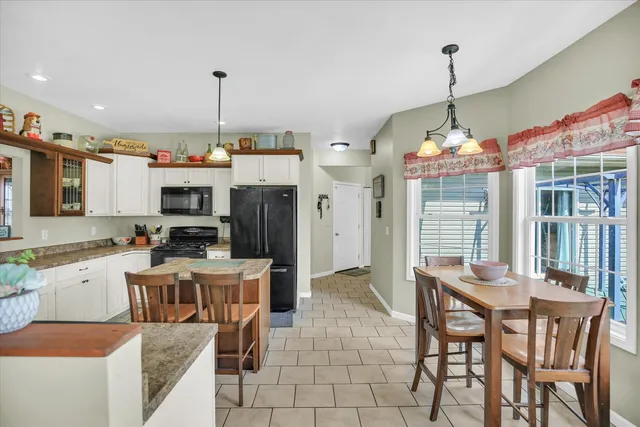 a kitchen with a stove a sink and a refrigerator