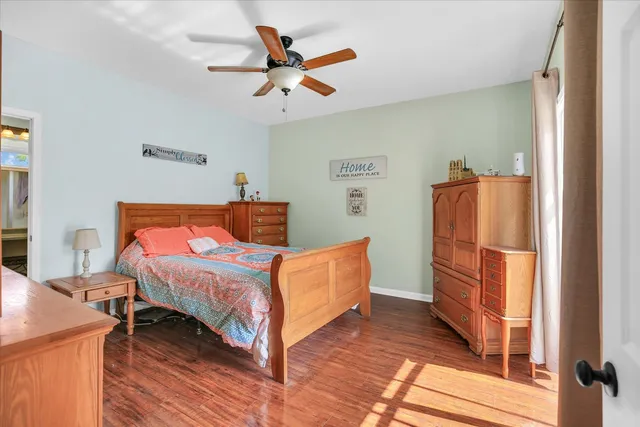 a bedroom with a bed and a dresser