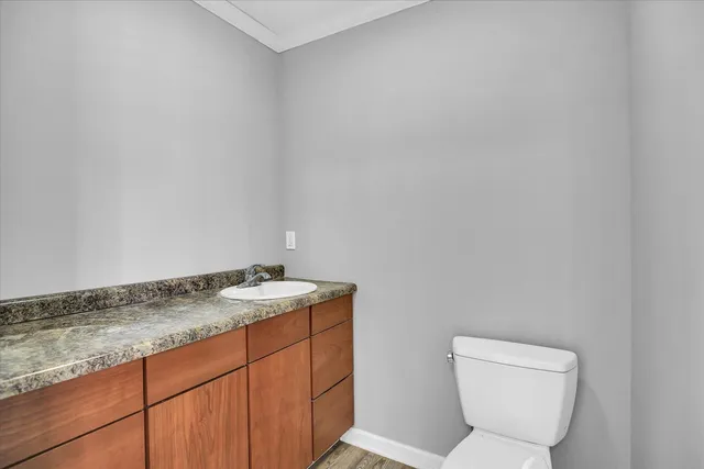 a bed room with a bed and a chandelier