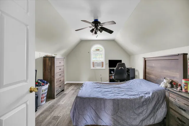 an aerial view of lake residential house with swimming pool