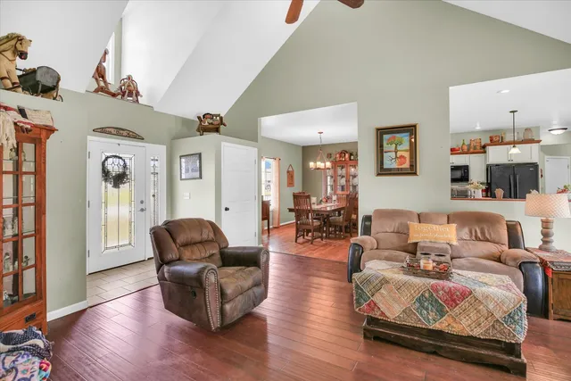 a living room with fireplace furniture and a flat screen tv