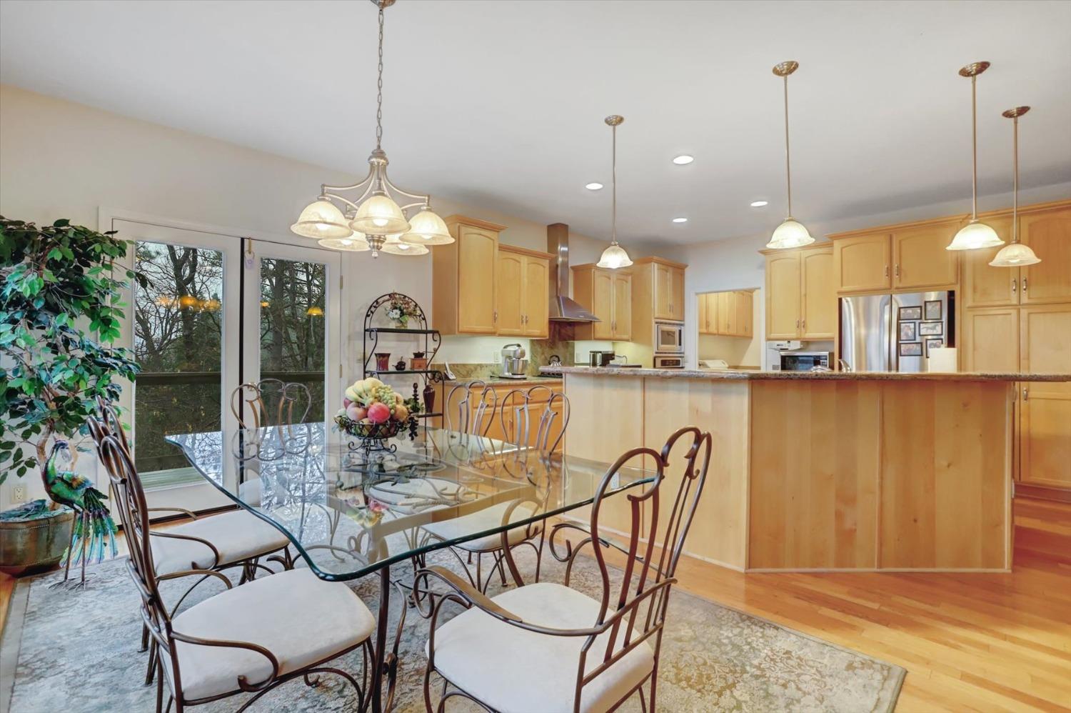 17036 Alice Way Grass Valley, CA 95949 - Photo 13 of 58 a dining room filled chandelier and kitchen view
